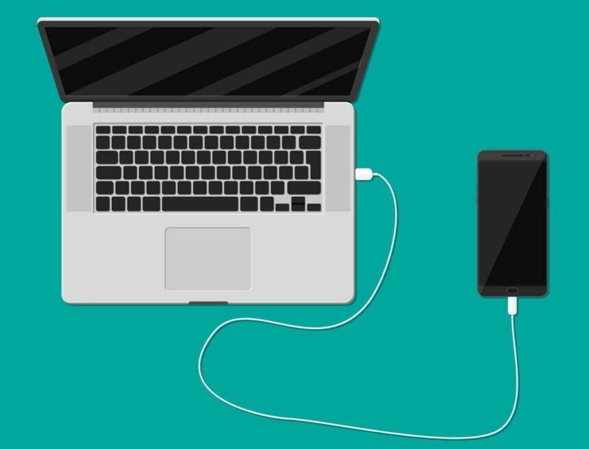 mobile phone charging from laptop usb port vector